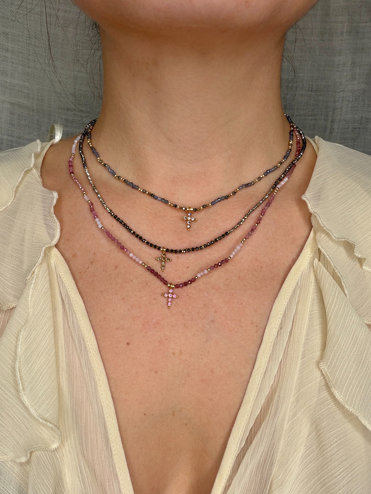 Three necklaces layered together; each sold individually