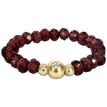 RHODOLITE RING WITH GOLD DETAILS
