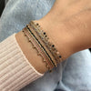 HANDMADE BEADED BRACELET IN NEUTRAL TONES WITH GOLD DETAILS