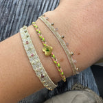 HANDMADE HEART BRACELET IN NEON TONES FEATURING A GREEN ONYX STONE