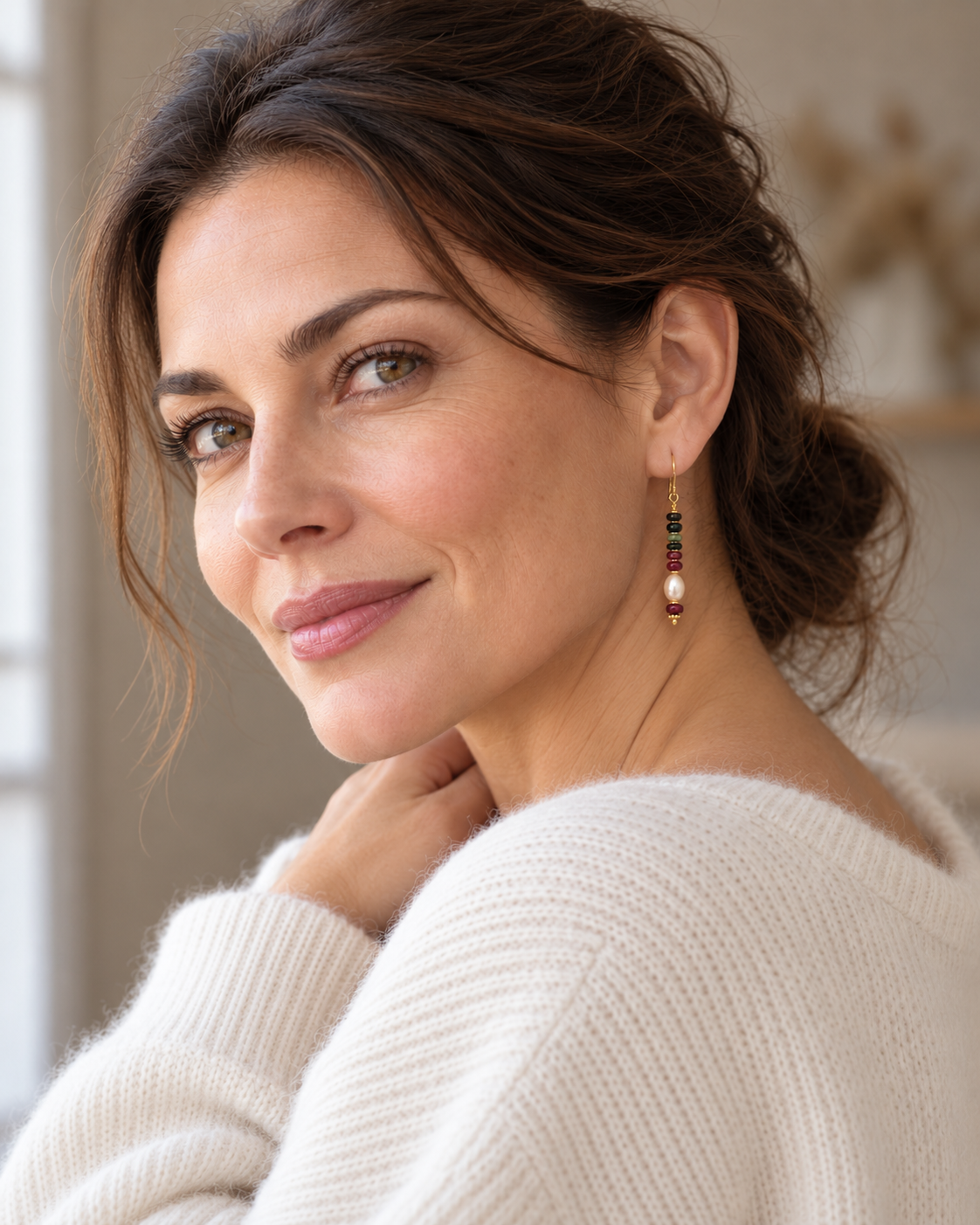 Model wearing Perla drop earrings with an ivory winter knit