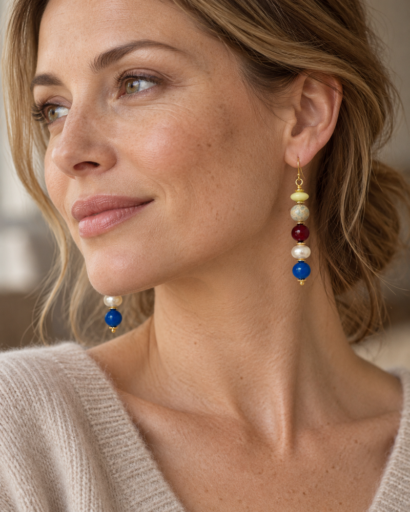 Model wearing Oceana earrings with an oatmeal knit