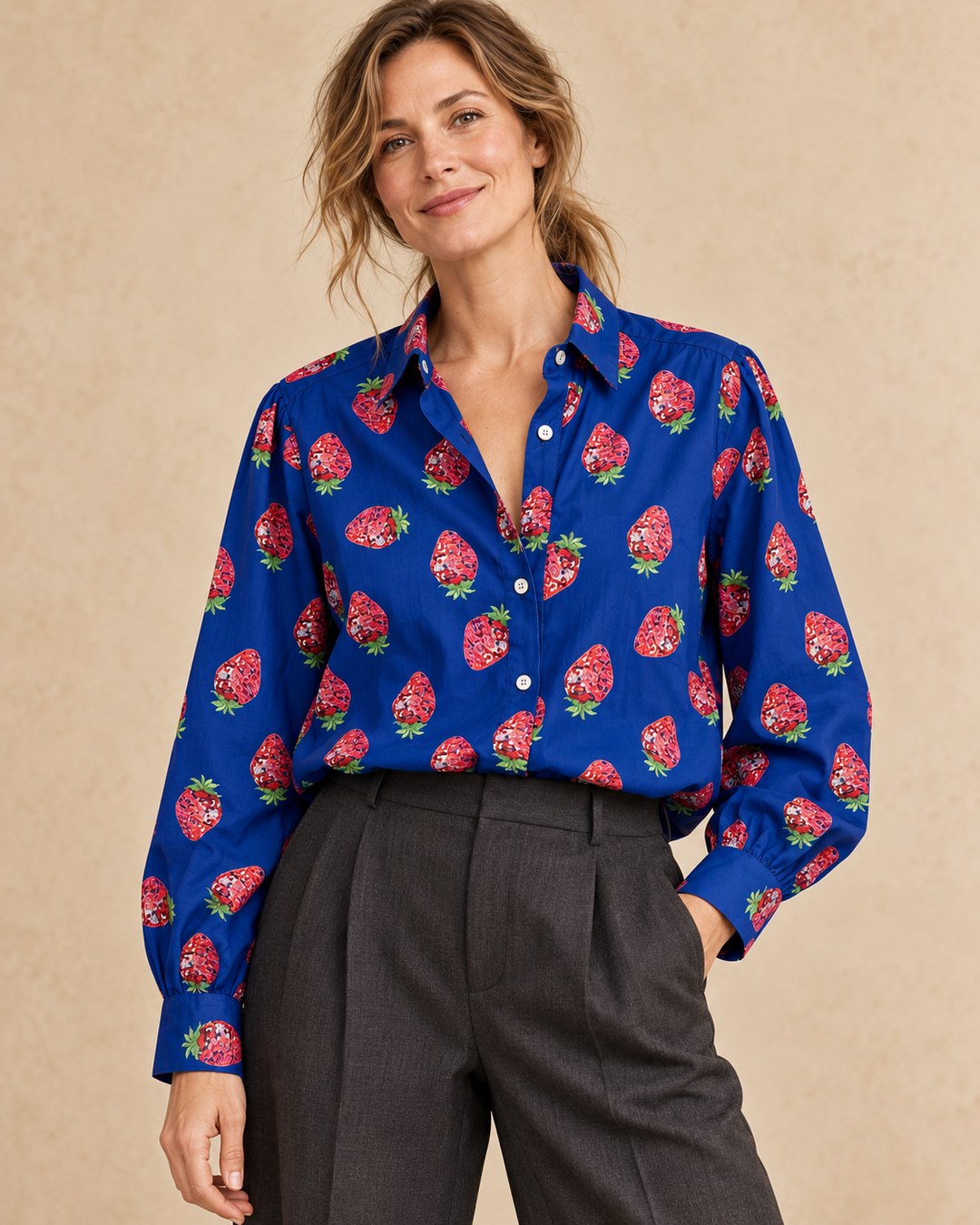 Close-up of Strawberry Disco Shirt tucked into dark wide-leg trousers, model with a ponytail