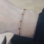 HANDMADE STONE SAND BRACELET FEATURING HESSONITE STONE AND GOLD BEADS DETAILS