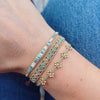 HANDMADE BEADED BRACELET IN PASTEL TONES WITH A TURQUOISE STONE