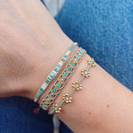 HANDMADE BEADED BRACELET IN PASTEL TONES WITH A TURQUOISE STONE