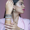 This beautiful hadmade bracelet has been handwoven in Colombia by our team of artisans using Polyester threads in pink tones with silver beads.  This can be worn solo or with your favourite pieces.  Details:      Polyester threads     925 silver beads     Handwoven adjustable bracelet     Width 5mm     Can be worn in the water     Women bracelet