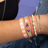 This stunning adjustable bracelet is handwoven by our team of master artisans using Japanese  glass beads in neon tones.  Wear yours stacked or solo to add a mood-boosting pop of color to any neutral look!  Details:      Japanese glass beads     Handwoven adjustable bracelet     Width11mm     Can be worn in the water