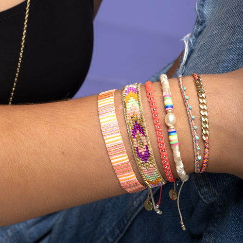 This stunning adjustable bracelet is handwoven by our team of master artisans using Japanese  glass beads in neon tones.  Wear yours stacked or solo to add a mood-boosting pop of color to any neutral look!  Details:      Japanese glass beads     Handwoven adjustable bracelet     Width11mm     Can be worn in the water