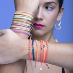 Handwoven in Colombia, this feminine bracelet features a single row of Japanese glass beads.  Wear this stylish bracelet alone or as a part of a bracelet layering combination, with your favourite jeans & t-shirt!  Details:  - Japanese glass beads  - Width: 2mm  - Adjustable bracelet   -Can be worn in the water