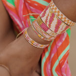 ZEBRA BEADED HANDMADE BRACELET IN BRIGHT PINK ON MODEL
