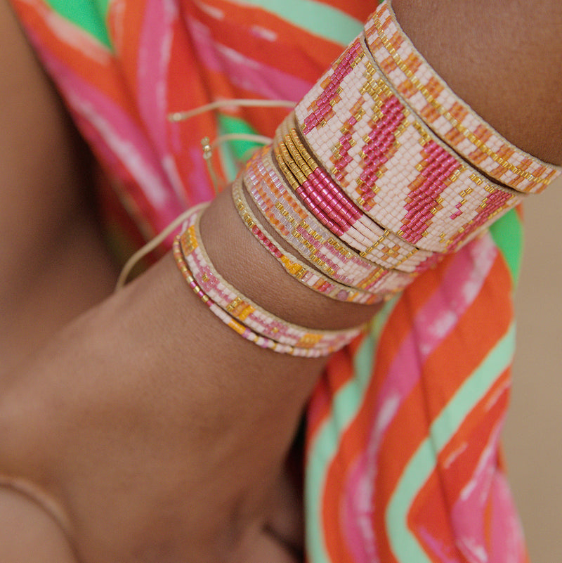 ZEBRA BEADED HANDMADE BRACELET IN BRIGHT PINK ON MODEL