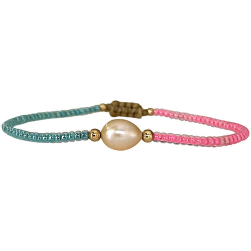 Make a confident statement with this beautiful handmade bracelet. This design is handwoven by our team of artisans using japanese glass beads,14k gold filled beads and a freshwater pearl.  This bracelet is elegant and femenine, making it the perfect accessory for any occasion.  Details  - Japanese glass beads   - 14 k gold filled beads  - Adjustable Bracelet  -Width: 2mm  -Can be worn in the  water