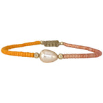 Make a confident statement with this beautiful handmade bracelet. This design is handwoven by our team of artisans using japanese glass beads,14k gold filled beads and a freshwater pearl.  This bracelet is elegant and femenine, making it the perfect accessory for any occasion.  Details  - Japanese glass beads   - 14 k gold filled beads  - Adjustable Bracelet  -Width: 2mm  -Can be worn in the  water