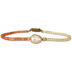 Make a confident statement with this beautiful handmade bracelet. This design is handwoven by our team of artisans using japanese glass beads,14k gold filled beads and a freshwater pearl.  This bracelet is elegant and femenine, making it the perfect accessory for any occasion.  Details  - Japanese glass beads   - 14 k gold filled beads  - Adjustable Bracelet  -Width: 2mm  -Can be worn in the  water