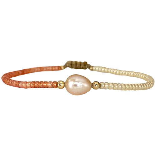 Make a confident statement with this beautiful handmade bracelet. This design is handwoven by our team of artisans using japanese glass beads,14k gold filled beads and a freshwater pearl.  This bracelet is elegant and femenine, making it the perfect accessory for any occasion.  Details  - Japanese glass beads   - 14 k gold filled beads  - Adjustable Bracelet  -Width: 2mm  -Can be worn in the  water