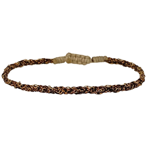 This handwoven beautiful creation makes this bracelet a unique piece using 14k gold filled chain. Wear them solo or together, depending on your mood.  Details:  - 14k gold filled CHAIN   - Gold metallic thread  - Adjustable Bracelet   - Width 4mm