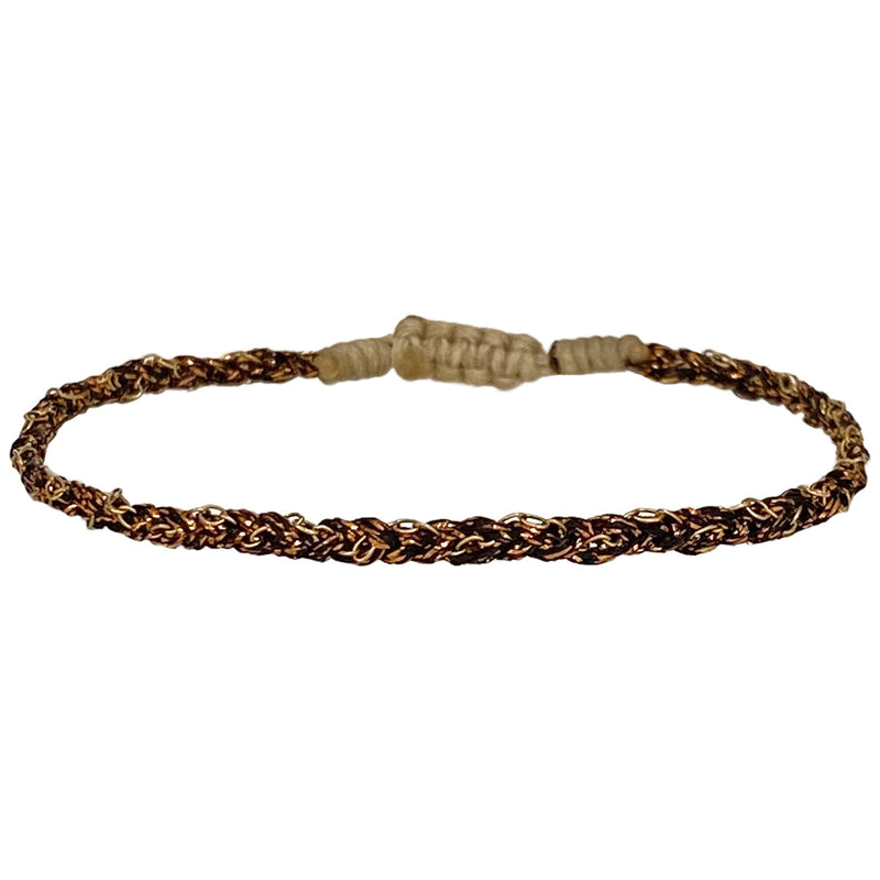 This handwoven beautiful creation makes this bracelet a unique piece using 14k gold filled chain. Wear them solo or together, depending on your mood.  Details:  - 14k gold filled CHAIN   - Gold metallic thread  - Adjustable Bracelet   - Width 4mm