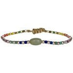 This cool  handwoven bracelet will enchant you with its unique design.This kids bracelet is handwoven using colourful beads and silver beads and a Jade stone as a center piece. Mix it as you like it and wear it with your favourite bracelets!  Details:  -Kids bracelet  -925 sterling silver beads   -Jade semi-precious stone  -colourful beads  -Adjustable bracelet  -Width: 2mm  -Can be worn in the  water