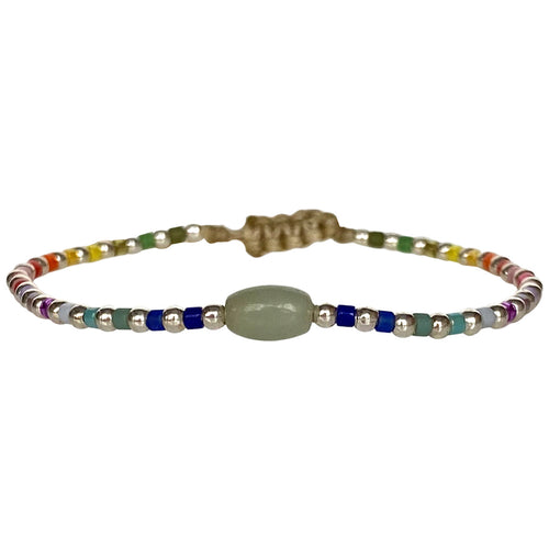 This cool  handwoven bracelet will enchant you with its unique design.This kids bracelet is handwoven using colourful beads and silver beads and a Jade stone as a center piece. Mix it as you like it and wear it with your favourite bracelets!  Details:  -Kids bracelet  -925 sterling silver beads   -Jade semi-precious stone  -colourful beads  -Adjustable bracelet  -Width: 2mm  -Can be worn in the  water