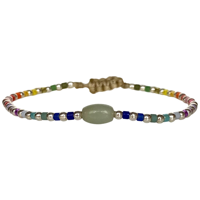 This cool  handwoven bracelet will enchant you with its unique design.This kids bracelet is handwoven using colourful beads and silver beads and a Jade stone as a center piece. Mix it as you like it and wear it with your favourite bracelets!  Details:  -Kids bracelet  -925 sterling silver beads   -Jade semi-precious stone  -colourful beads  -Adjustable bracelet  -Width: 2mm  -Can be worn in the  water
