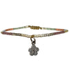 This beautiful kids bracelet is handwoven using Japanese glass beads and a 925 sterling silver flower charm.    Wear it with your favourite accessories!  Details:  -Kids bracelet  - Japanese glass beads  - 925 sterling silver charm   -Width: 2mm  -Adjustable bracelet