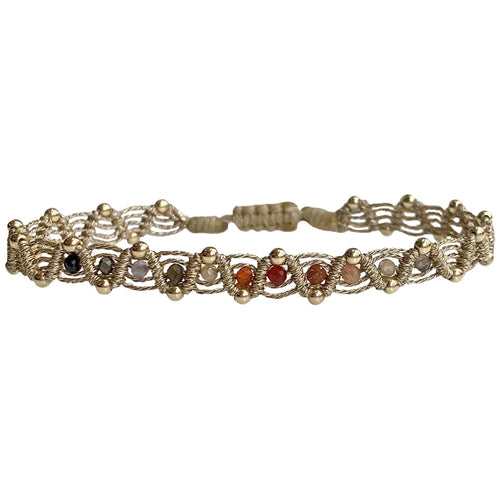 technique, 14K gold filled beads and intermixed semi precious stones.  Perfect for your summer holidays or to wear  with your favourite jeans   Details:  - Handwoven using metallic threads  - Intermixed semi-precious stones.  - 14K gold filled beads    - Adjustable Bracelet  - Width: 6mm  -Can be worn in the  water