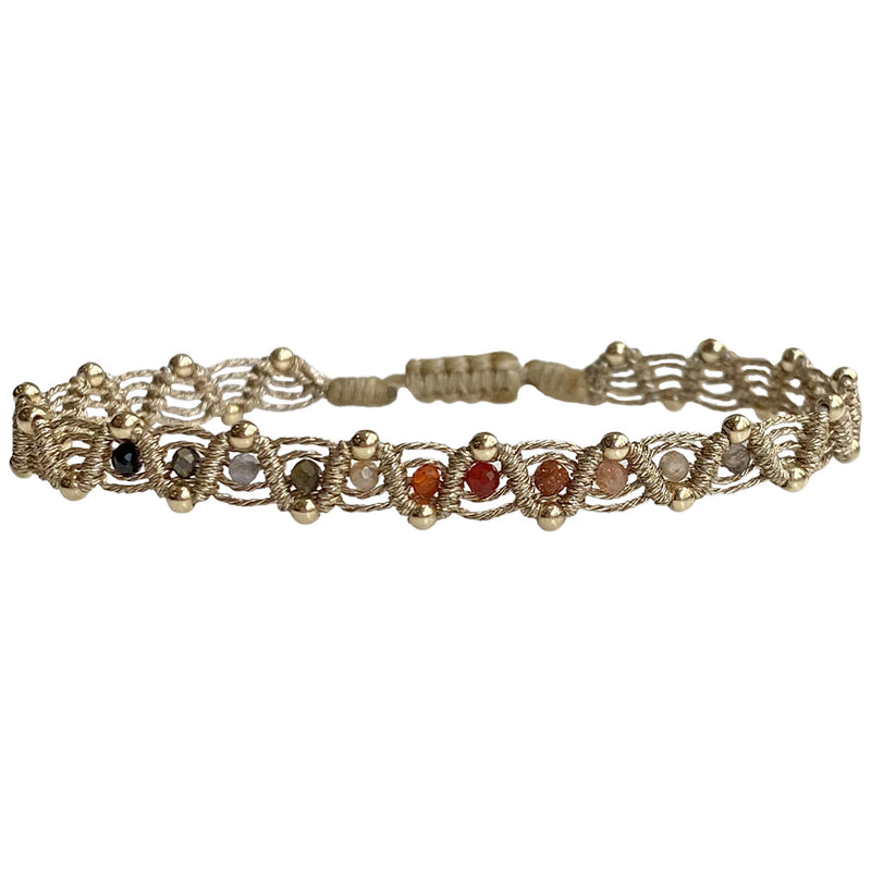 technique, 14K gold filled beads and intermixed semi precious stones.  Perfect for your summer holidays or to wear  with your favourite jeans   Details:  - Handwoven using metallic threads  - Intermixed semi-precious stones.  - 14K gold filled beads    - Adjustable Bracelet  - Width: 6mm  -Can be worn in the  water