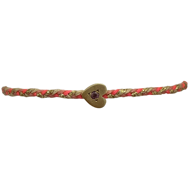 This delicate bracelet is handmade by our team of master artisans using metallic threads and a gold heart charm encrusted with a beautiful pink tourmaline stone. It's the perfect accessory to add a little sparkle in your life.  Details:      Pink tourmaline semi-precious stone     Gold Vermeil setting     Women bracelet     Adjustable handwoven bracelet     Width 5mm