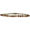 If you wish for sophistication and originality this bracelet is just for you. It is handwoven by our team of artisans using tundra sapphire semi-precious stones, 14 k gold filled beads and metallic threads.  The tundra sapphire stone will bring you balance within the body, lightness and joy.  Details:  - Tundra sapphire semi-precious stones  - 14k gold filled beads  - Metallic threads  -Adjustable bracelet  -Width: 4mm