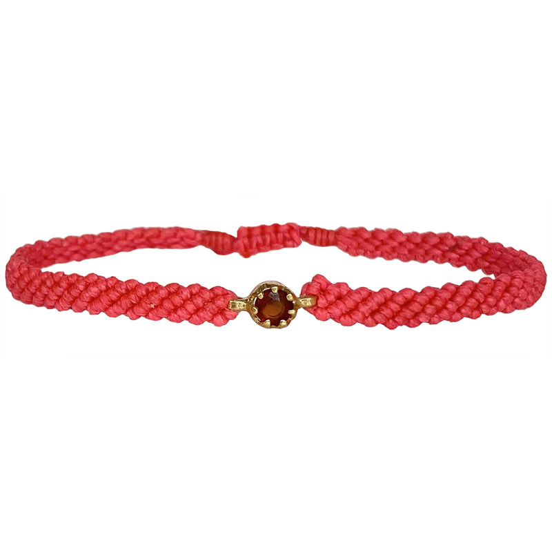 This gorgeus bracelet is handwoven by our team of master artisans using macramé techniques. An impressive Hessonite is the centerpiece of this iconic design. It's the perfect accessory to add a little sparkle in your life.  Details:      Hessonite semi-precious stone     Vermeil setting     Macramé weaving technique     Adjustable handwoven bracelet     Width 4mm