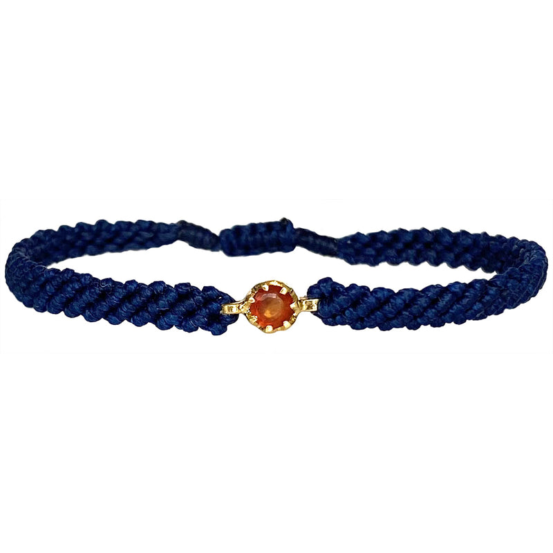 This gorgeus bracelet is handwoven by our team of master artisans using macramé techniques. An impressive Hessonite is the centerpiece of this iconic design. It's the perfect accessory to add a little sparkle in your life.  Details:      Hessonite semi-precious stone     Vermeil setting     Macramé weaving technique     Adjustable handwoven bracelet     Width 4mm