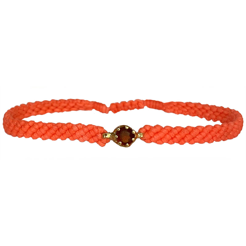 This gorgeus bracelet is handwoven by our team of master artisans using macramé techniques. An impressive Hessonite is the centerpiece of this iconic design. It's the perfect accessory to add a little sparkle in your life.  Details:      Hessonite semi-precious stone     Vermeil setting     Macramé weaving technique     Adjustable handwoven bracelet     Width 4mm