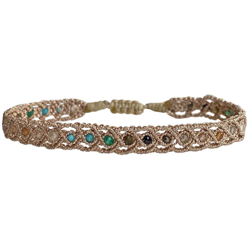 If you wish for simple elegance and versatility this handmade bracelet is just for you. It is handwoven by our team of artisans using intermixed semi-precious stones and metallic threads.  Details:  - Women bracelet  - Semi precious stones  -Adjustable bracelet  -Width: 5mm  -Can be worn in the water