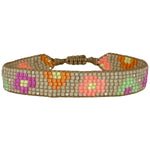 This stunning adjustable bracelet is handwoven using Japanese  glass beads and features flower print patterns in bright tones.  Wear yours stacked or solo to add a mood-boosting pop of color to any neutral look!  Details:      Japanese glass beads     Handwoven adjustable bracelet     Width11mm     Can be worn in the water