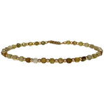 This delicate jewel is handmade using gold filled beads and Tsavorite semi-precious stones. This beauty will be one of your favorite bracelets as you can wear it with any accessories or outfits. Give to your looks a touch of elegance and sparkle !  Details:  - Tsavorite semi-precious stones   - 14 K gold filled beads  -Adjustable bracelet  -width: 2m  -Can be worn in the water