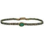 Delicate & feminine, this bracelet is handwoven using metallic gold and green threads and features a green onyx precious stone centrepiece. Onyx stones are symbols of happiness.  Wear it with your favourite accessories all season long, and with its adjustable pull cord you will always have the perfect fit!  Details:  - Onyx precious stone  - Vermeil setting   -Metallic threads  -Adjustable bracelet 