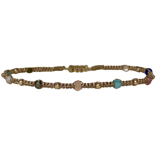 This delicate design is handwoven by our team of artisans in Colombia using metallic threads, intermixed semi-precious stones and 14k gold filled beads.  Wear it solo or with your favourite accessories!  Details:  -Handmade bracelet  -Women bracelet  -Metallic threads   -Intermixed semi-precious stones  -14k gold filled beads  -Adjustable bracelet   -Width: 3mm  -Can be worn in the wate