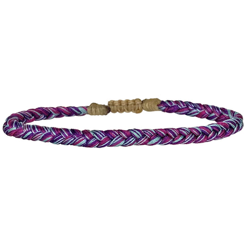This bracelet is handwoven by our team of master artisans using polyester threads featuring a trenza design in purple and blue tones. This kids's bracelet is cool and comfortable perfect to wear everyday.  This bracelet looks great worn solo or layered with other pieces.  Details:      Polyester threads     Kids's bracelet     Adjustable bracelet     Width 4mm     Can be worn in the water