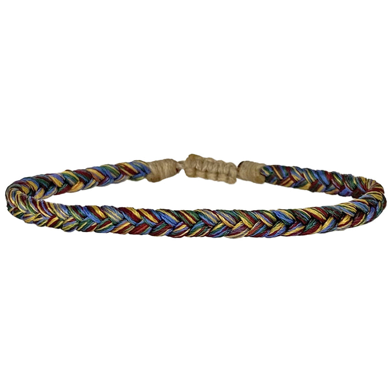 This bracelet is handwoven by our team of master artisans using polyester threads featuring a trenza design. This kids's bracelet is cool and comfortable perfect to wear everyday.  This bracelet looks great worn solo or layered with other pieces.  Details:      Polyester threads     Kids's bracelet     Adjustable bracelet     Width 4mm     Can be worn in the water