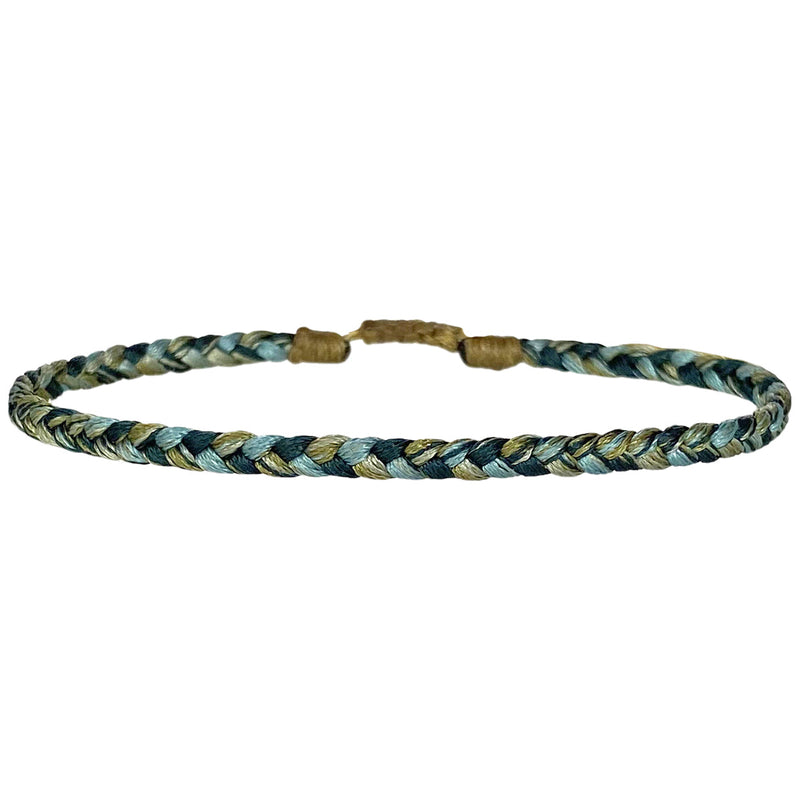 This bracelet is handwoven by our team of master artisans using polyester threads featuring a trenza design in aqua tones. This men's bracelet is cool and elegant perfect to wear everyday.  This bracelet looks great worn solo or layered with other pieces.  Details:      Polyester threads     Men's bracelet     Adjustable bracelet     Width 4mm     Can be worn in the water