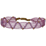 This beautiful handwoven bracelet features a web like design with 14k rose gold filled beads. This unique design can be worn under water and all season long.   Wear it with your favourite jeans and t-shirt!   Details:      14k rose gold filled  bead details     Metallic threads     Handwoven adjustable bracelet     Width 0.8 cm 