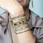 If you wish for sophistication and originality this bracelet is just for you. It is handwoven by our team of artisans using tundra sapphire semi-precious stones, 14 k gold filled beads and metallic threads.  The tundra sapphire stone will bring you balance within the body, lightness and joy.  Details:  - Tundra sapphire semi-precious stones  - 14k gold filled beads  - Metallic threads  -Adjustable bracelet  -Width: 4mm