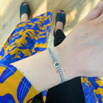 HANDMADE LABRADORITE STONE BRACELET IN DARK TONES ON MODEL