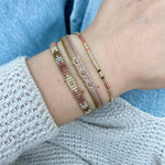 SET OF THREE BEIGE AND PINK HANDMADE BRACELETS