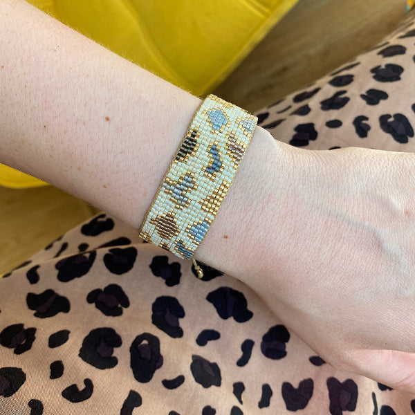 HANDMADE LEOPARD BRACELET IN BLUE AND  NUDE TONES ON MODEL