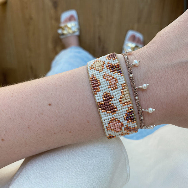 HANDMADE LEOPARD BRACELET IN ROSE GOLD AND NEUTRAL TONES ON MODEL