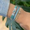 HANDWOVEN HEART BRACELET IN BLUE & SILVER TONES