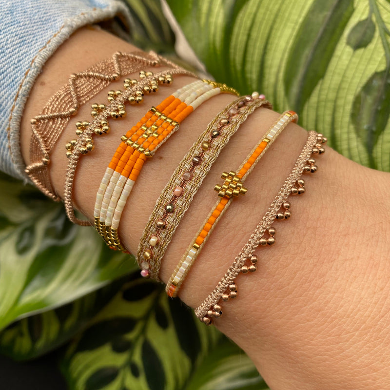 HANDWOVEN HEART BRACELET IN ORANGE AND GOLD