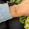 HANDWOVEN HEART BRACELET IN ORANGE AND GOLD